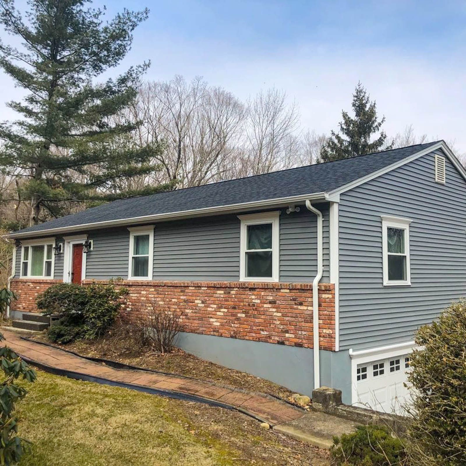 A house with a new blue siding and roof