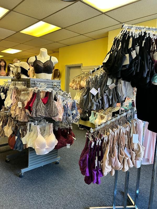 A store filled with lots of bras hanging on racks.