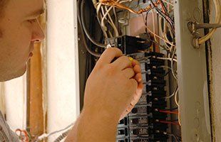 An electrician repairing circuit board