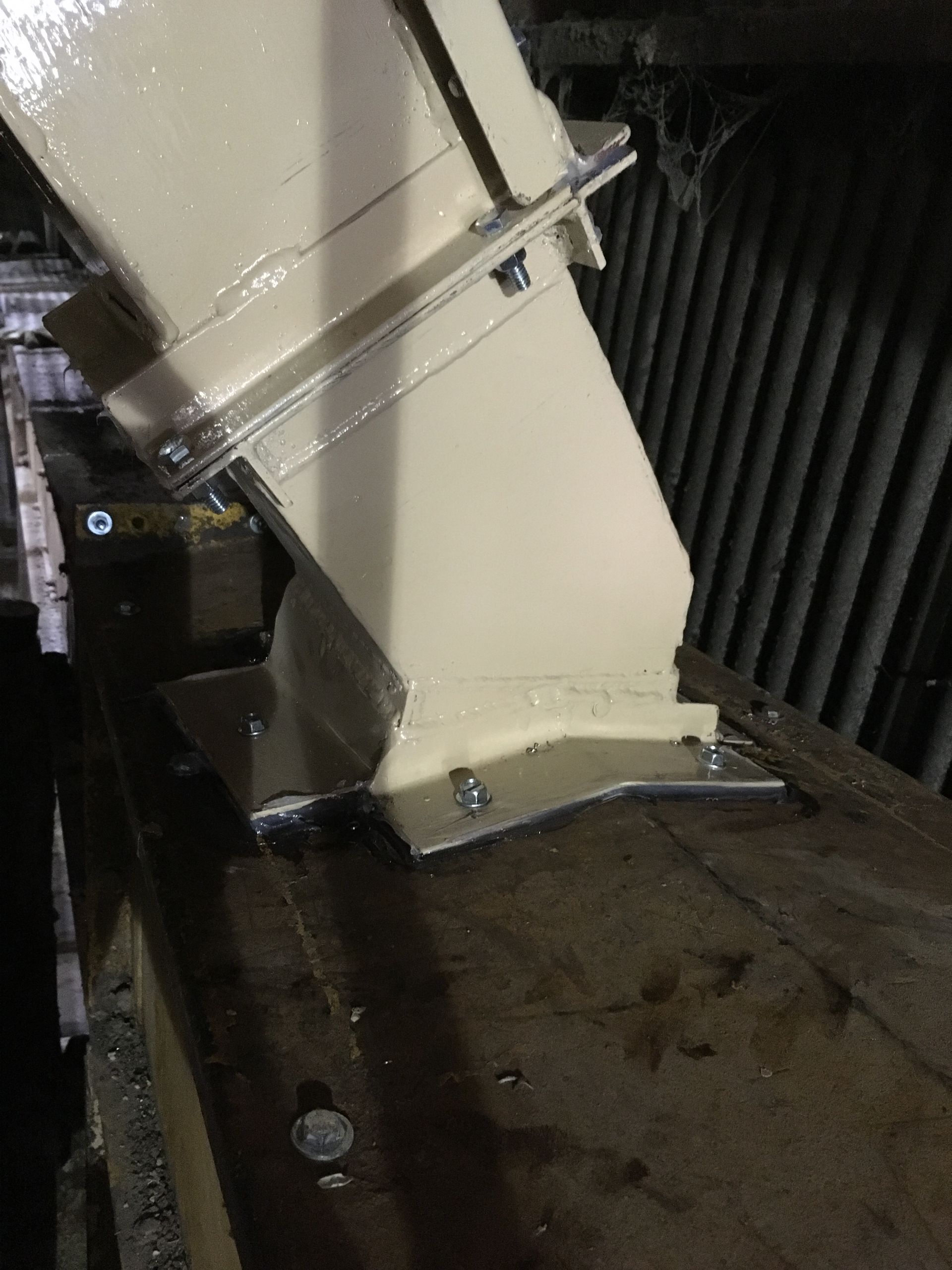 A piece of metal is sitting on top of a wooden table