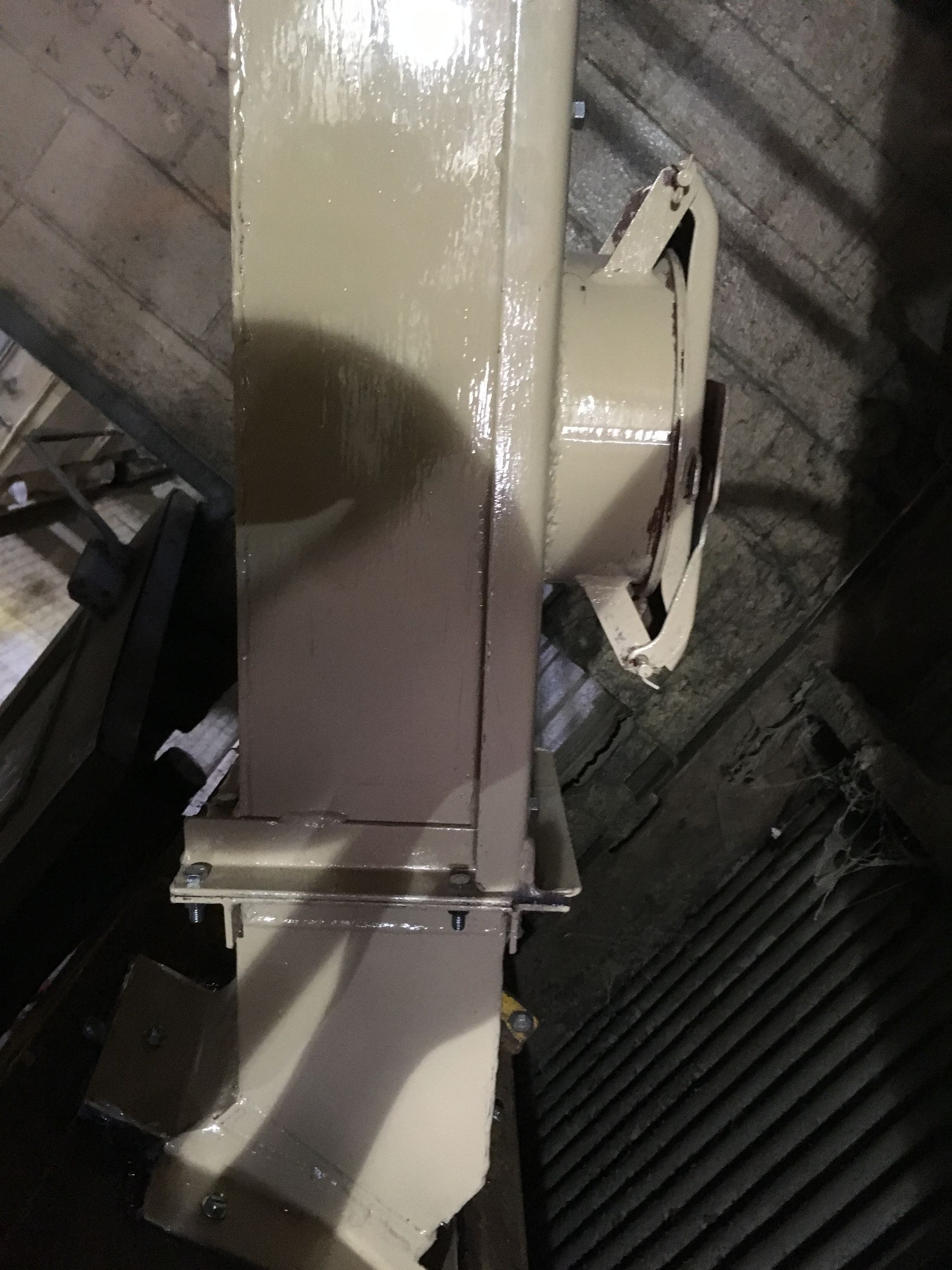 A white machine is sitting in a dark room