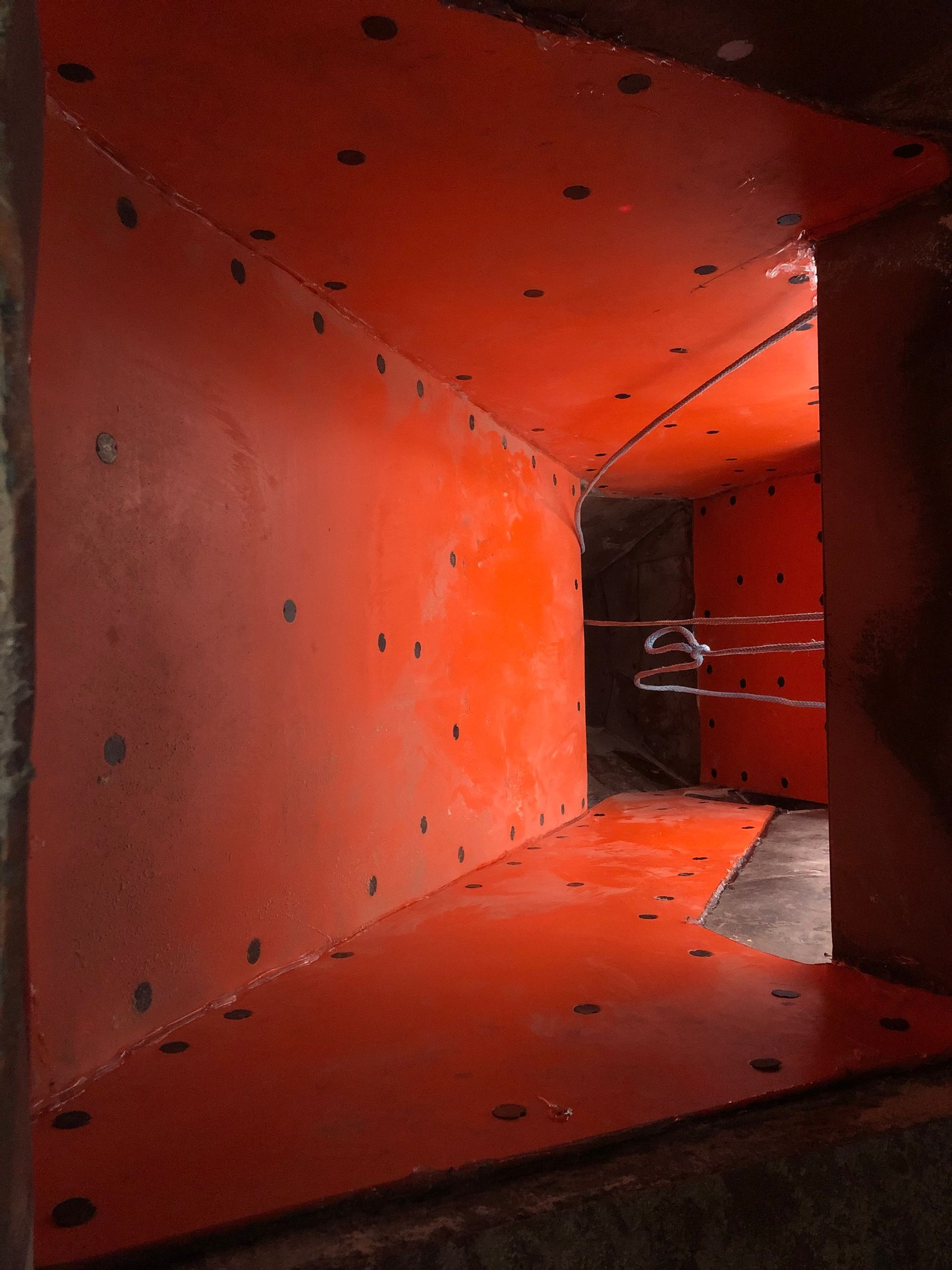 A room with a red wall and a red floor