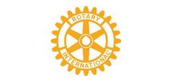Golden Rotary International emblem with a cogwheel design.