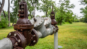 Water main pipe with back flow prevention