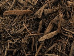A close up of a pile of brown mulch.
