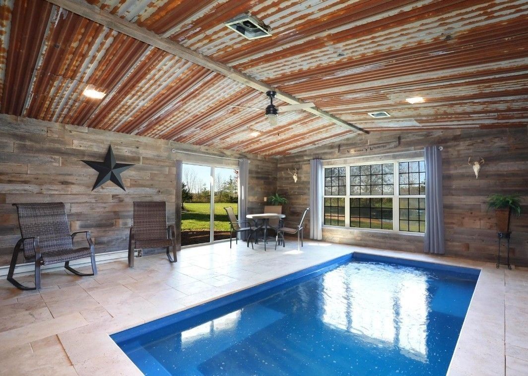 A large indoor swimming pool with a star on the wall