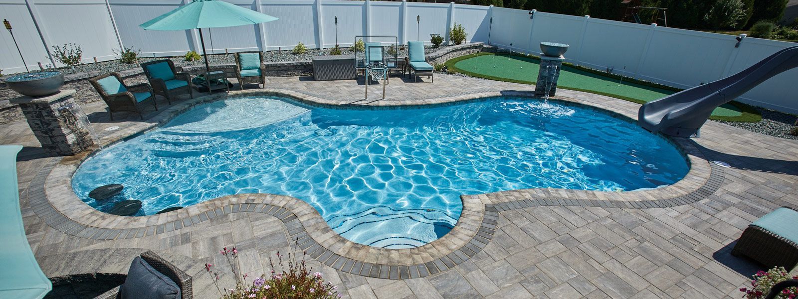 There is a fire pit in the backyard of a house.