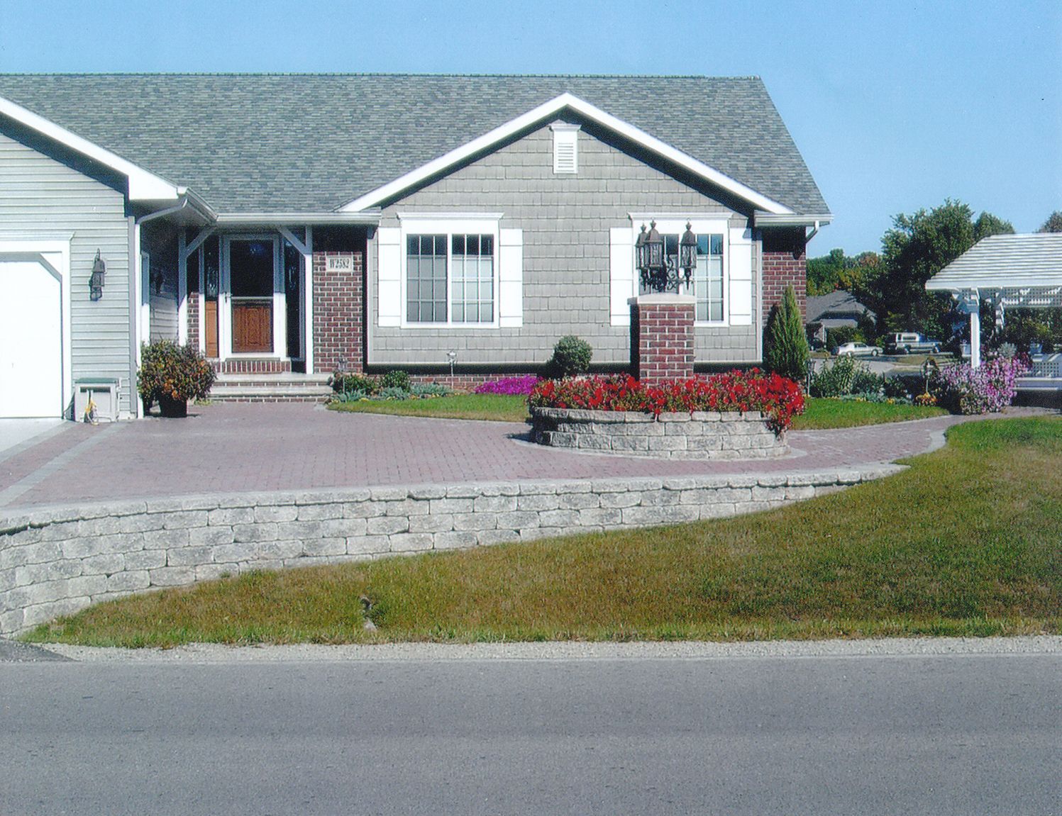 There is a large swimming pool in the backyard with a slide.