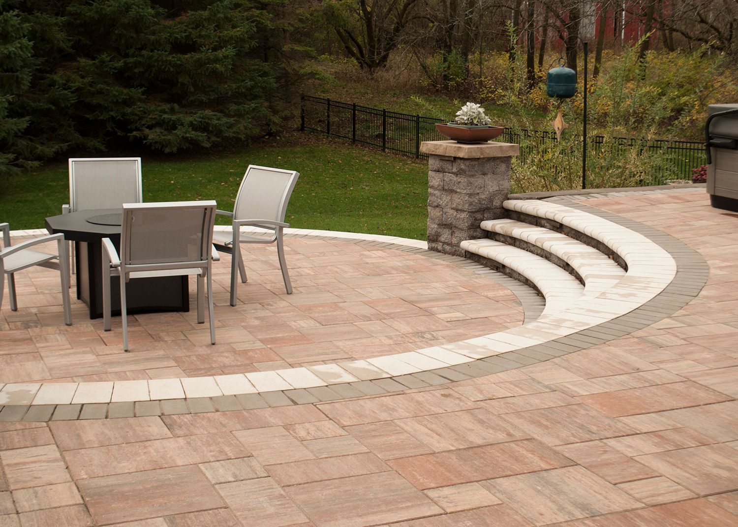 A patio with a table and chairs on it