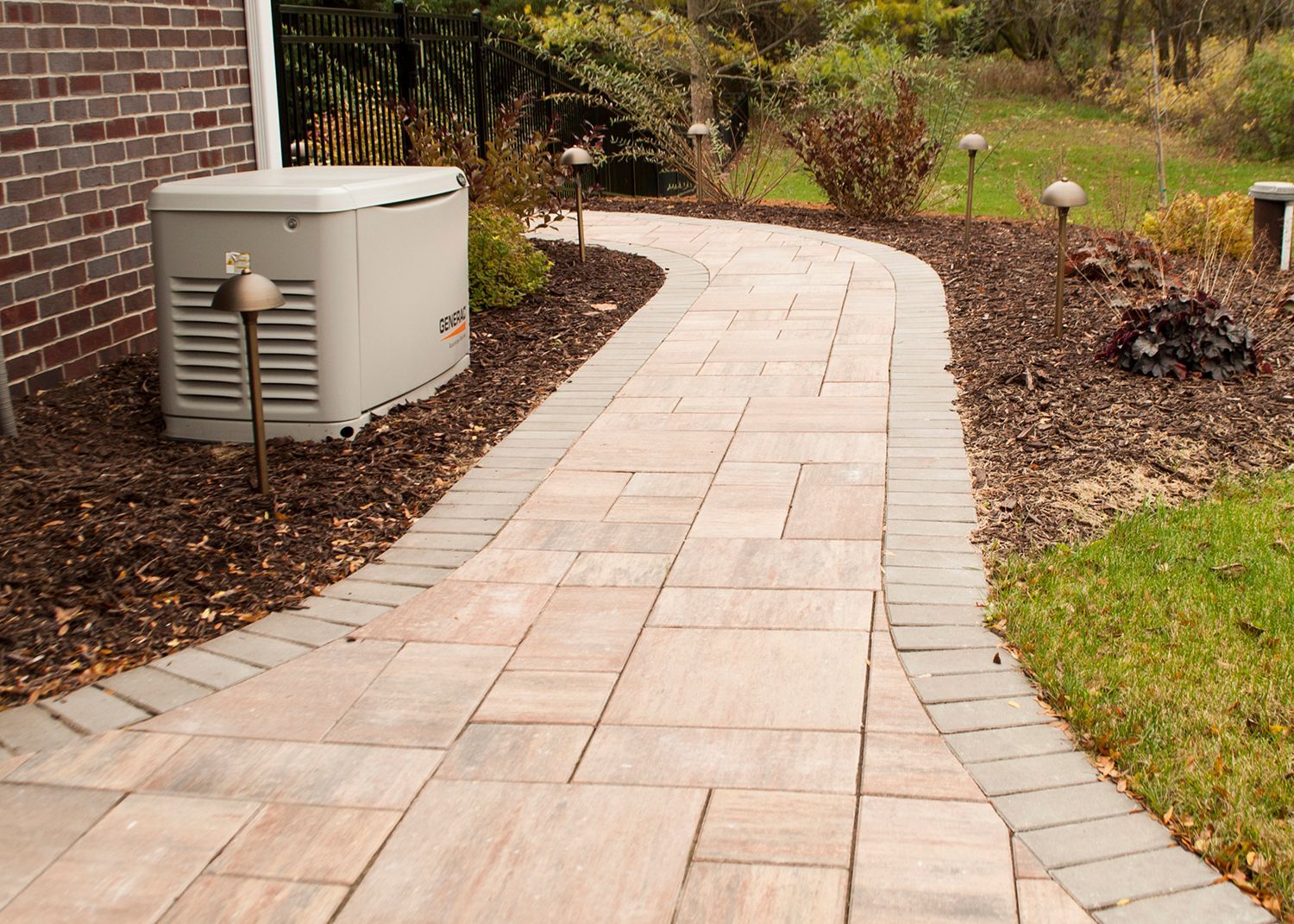 A walkway with a generator on the side of it