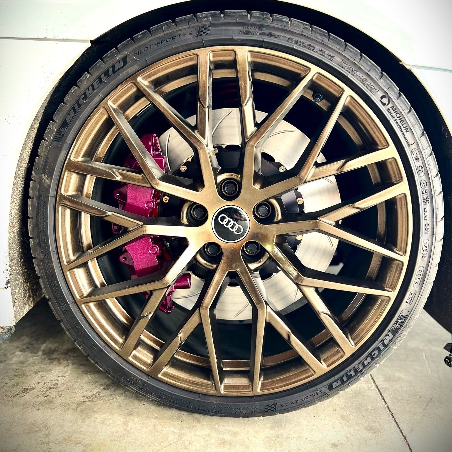 A close up of a car wheel with a tire on it.