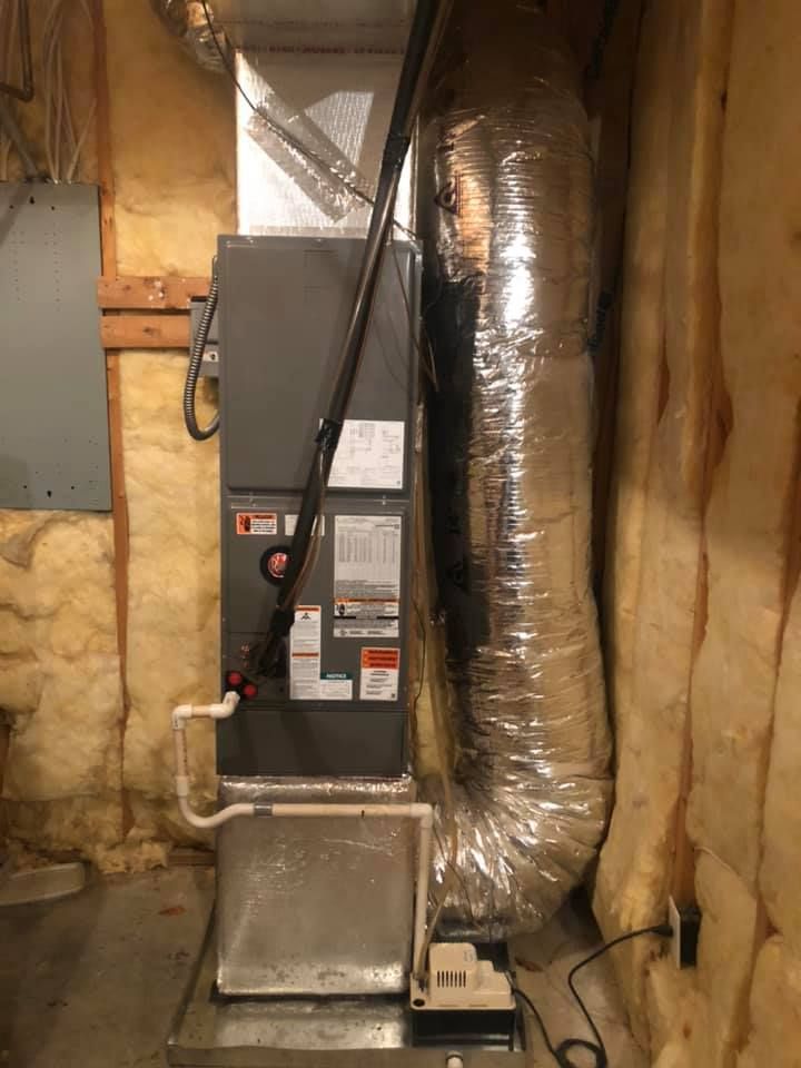 A heating and cooling system is installed in a basement.