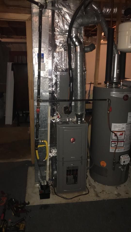 There is a water heater and a furnace in the basement.