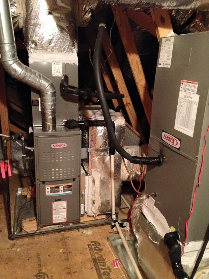 A picture of an air conditioning system in a basement.