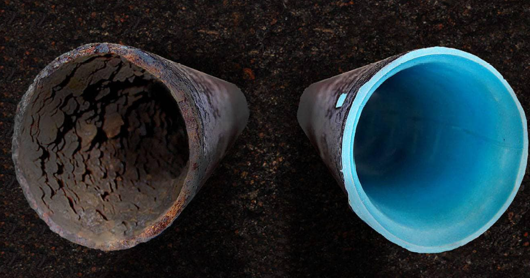 Two pipes side by side: one rusted and clogged, the other clean with a bright blue interior.