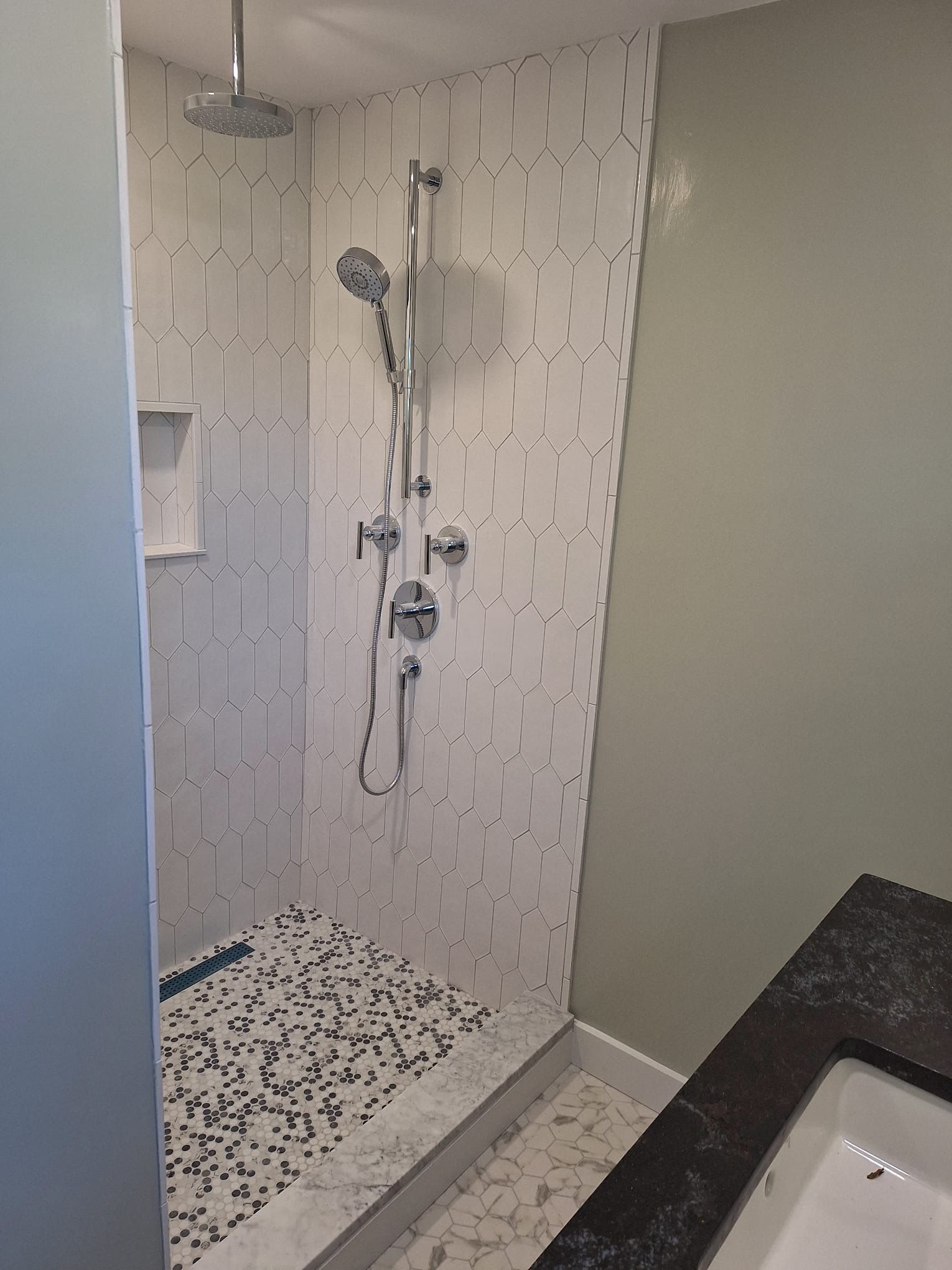 A bathroom with a walk in shower and a bathtub.