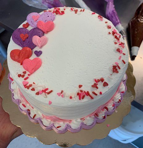 white cake with hearts design