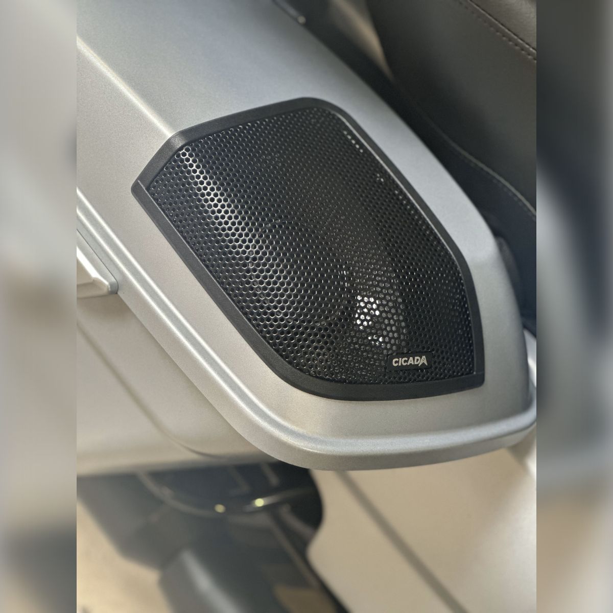 A close up of a speaker on the side of a motorcycle