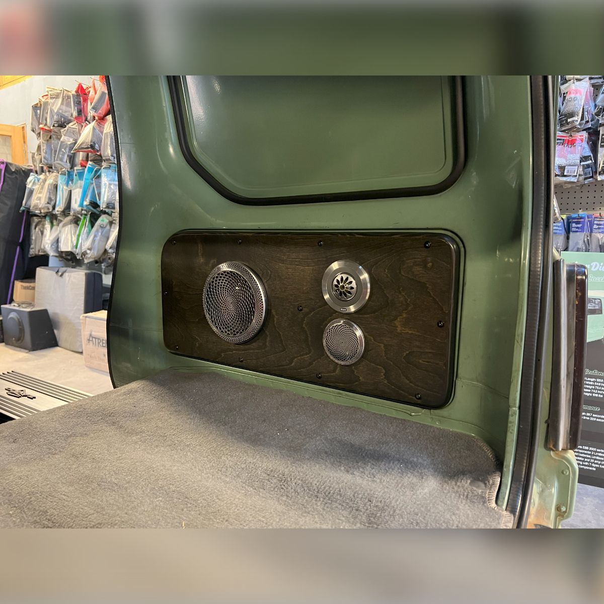 A car with two speakers in the back of it.