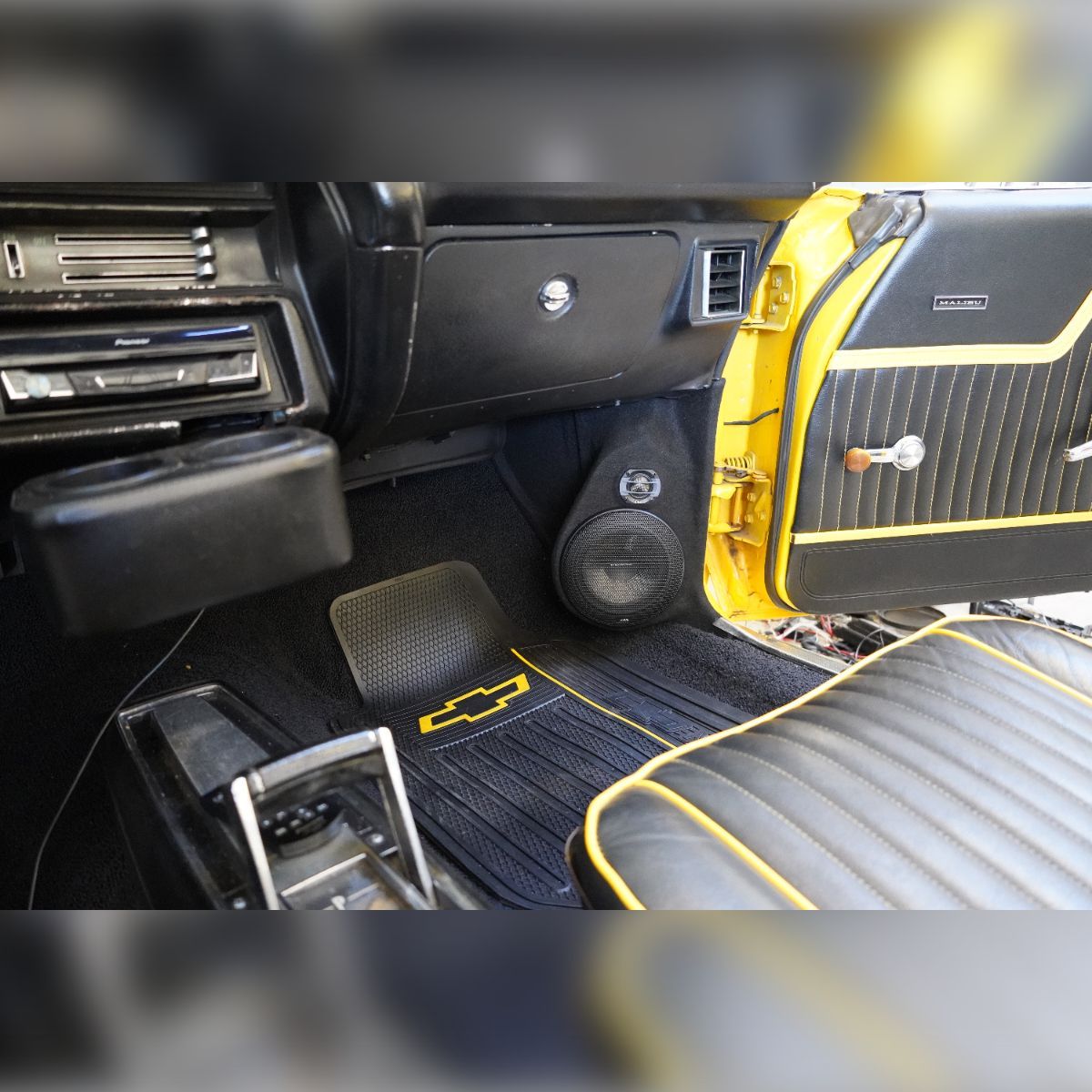 A black and yellow car with a yellow door