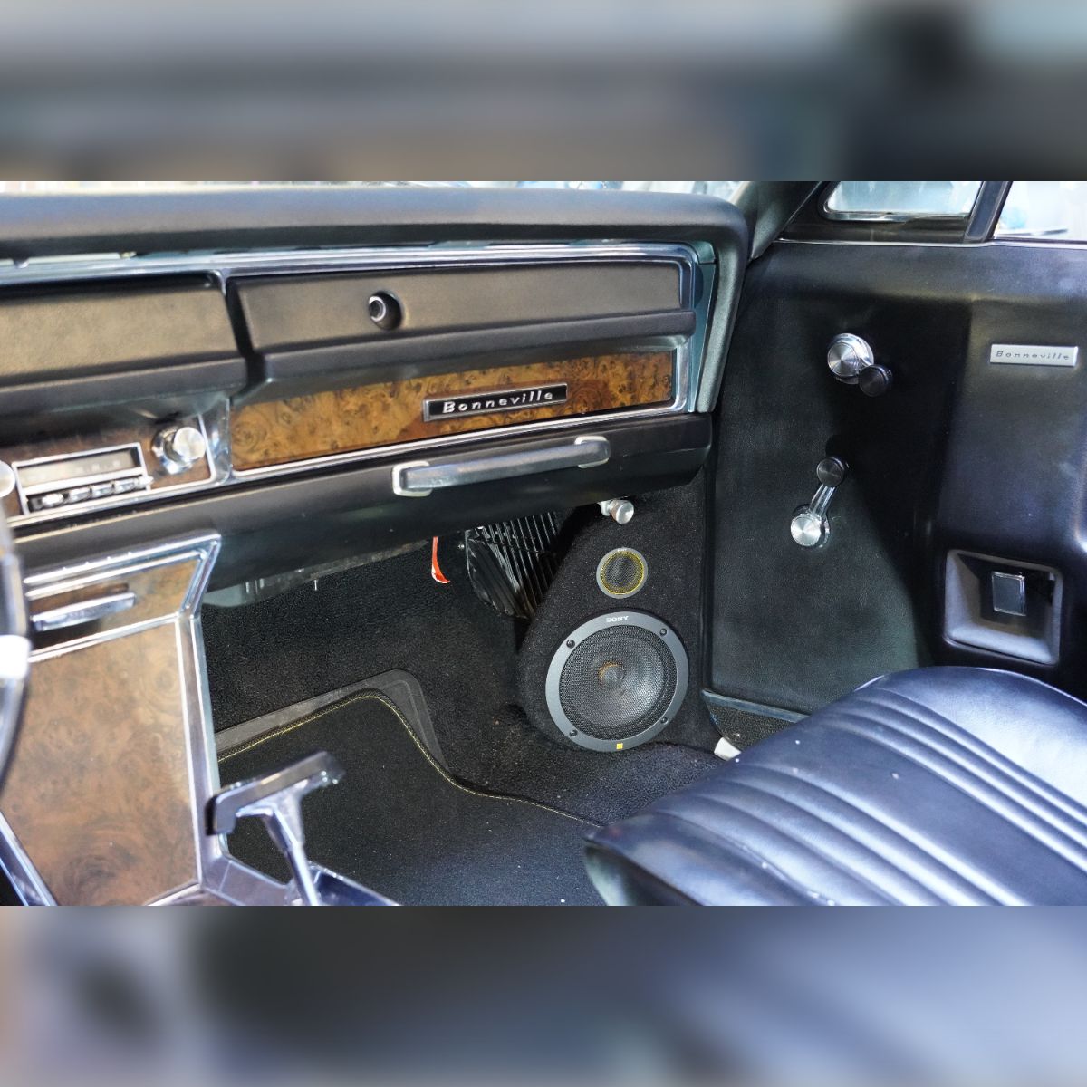 The interior of a car with a speaker in the back