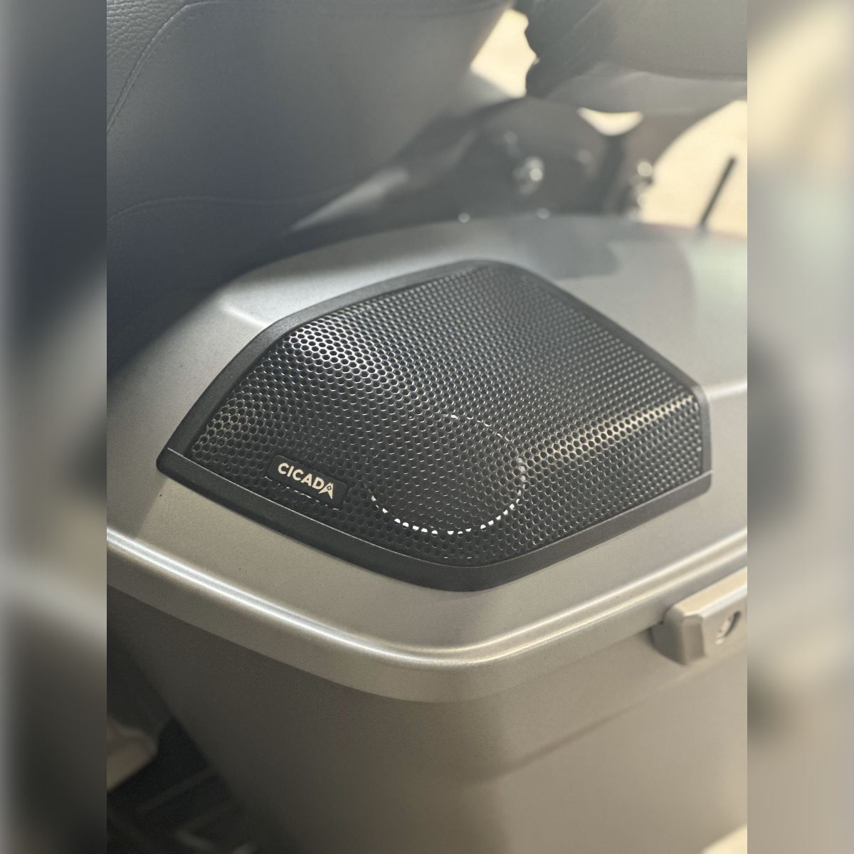 A close up of a speaker on the side of a motorcycle