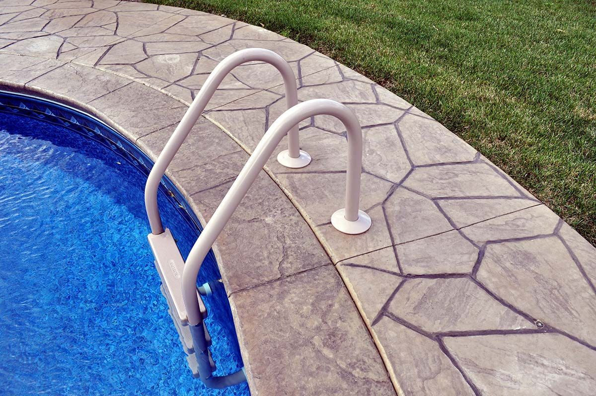 A swimming pool with a staircase leading to it