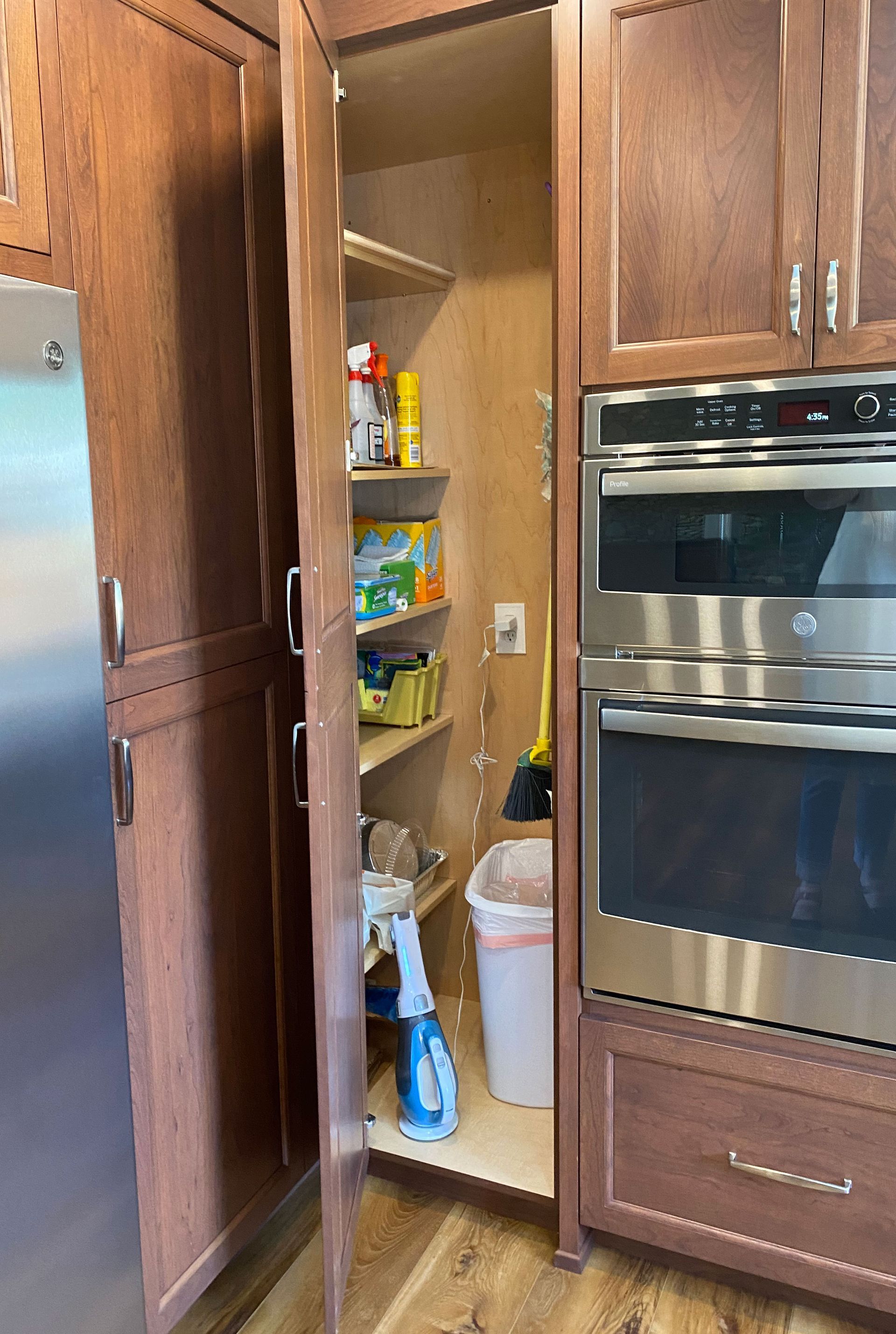 a kitchen with stainless steel appliances and wooden cabinets