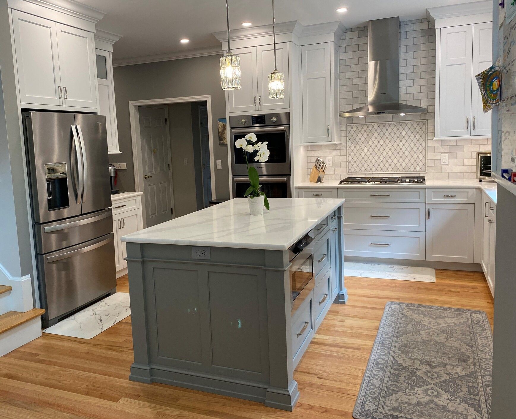 there is a large island in the middle of the kitchen