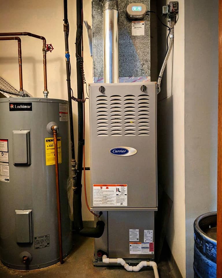 There is a water heater and a heating system in the room.