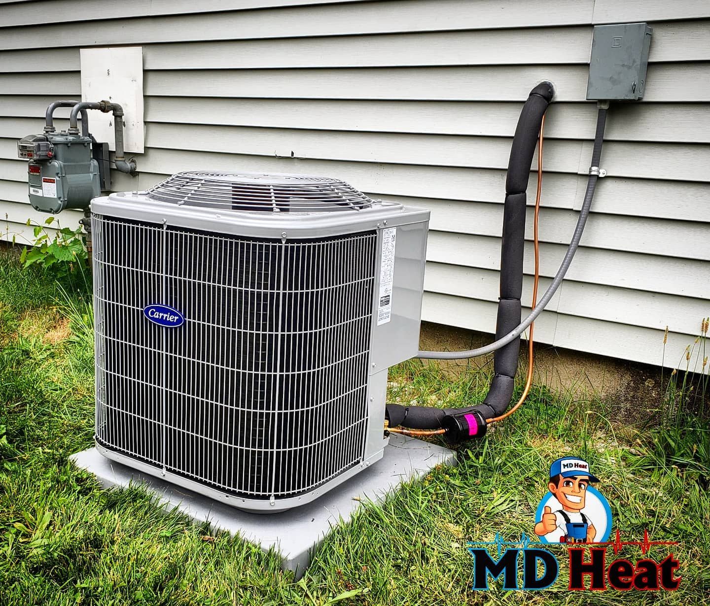 A large air conditioner is sitting outside of a house.