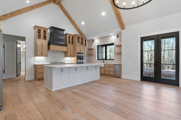 There is a large island in the middle of the kitchen.