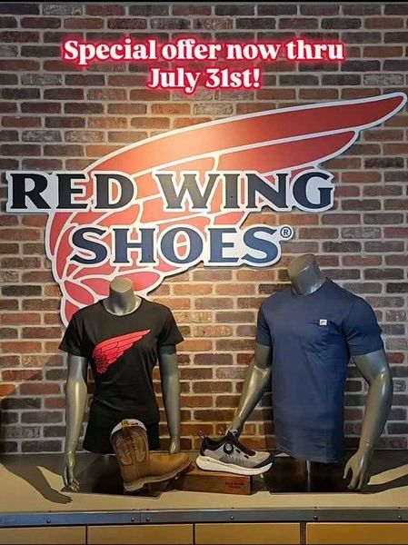 Red Wing Shoes storefront display with special offer sign, shirts, and boots on mannequins