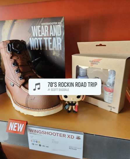 Work boot beside product boxes on a shelf, with a music label reading “70s Rockin Road Trip.”