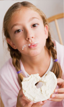Girl eating a bagel