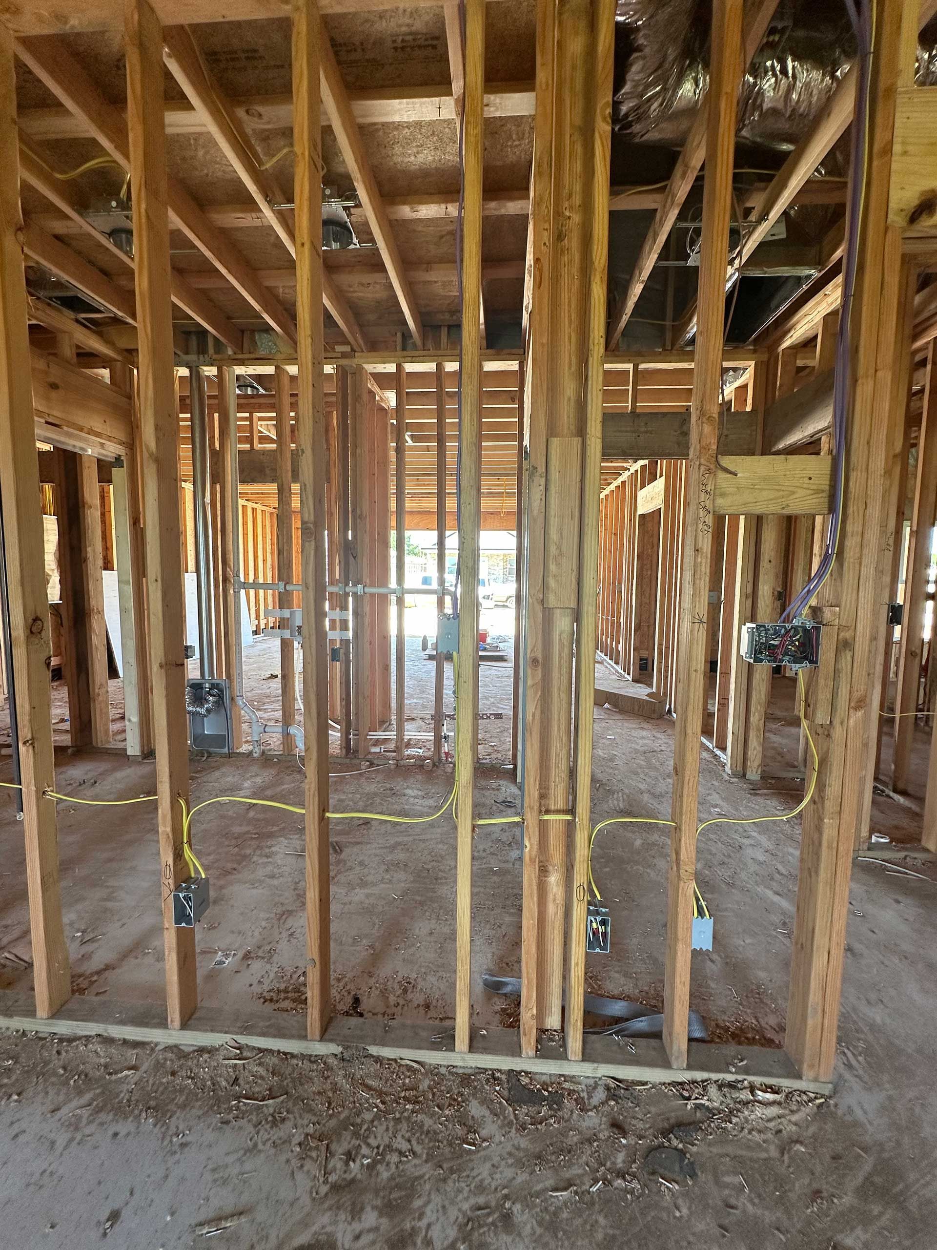 a building under construction with a lot of wooden beams