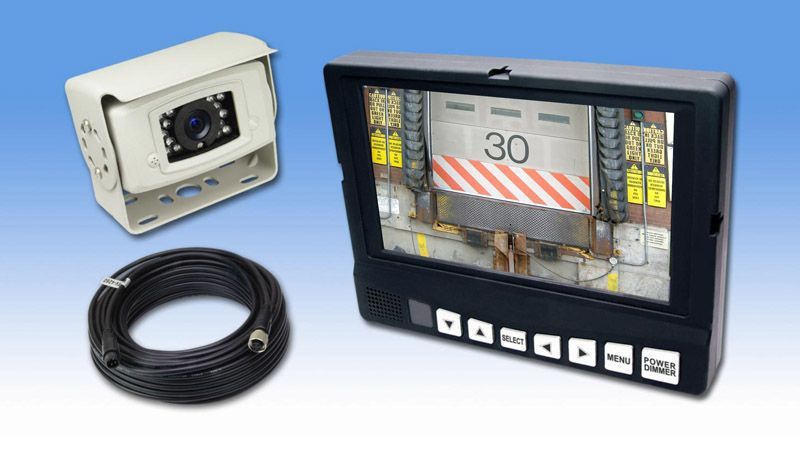 Security camera system: camera, monitor displaying garage, cable, and a blue gradient background.