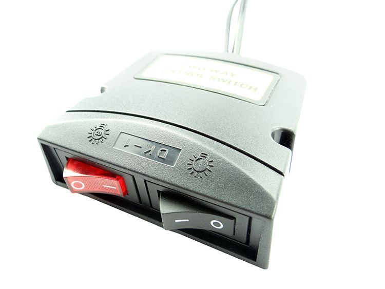 Black control panel with two switches (red/black) and a small display.