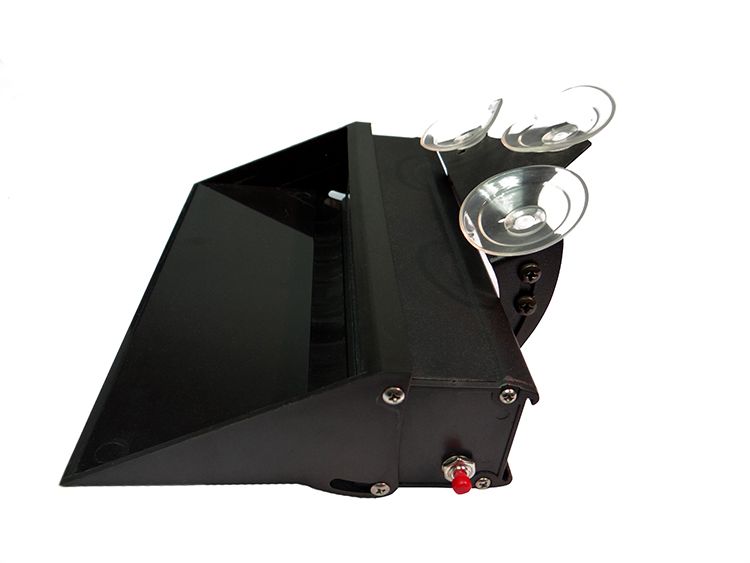 Black, angled, electronic device with a screen and suction cups, likely for a car.