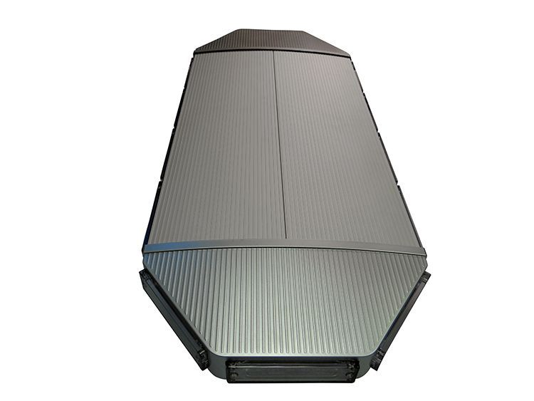Modern, silver speaker with vertical grill design and a trapezoid shape.
