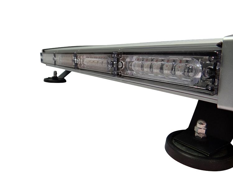 Emergency vehicle light bar, silver, with flashing white and clear lights. Mounted on a vehicle roof.