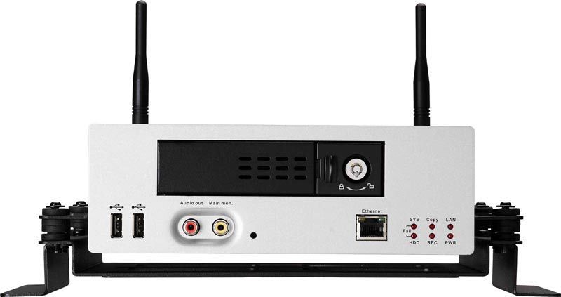 White device with antennas, ports, and a lock, mounted on a black bracket.