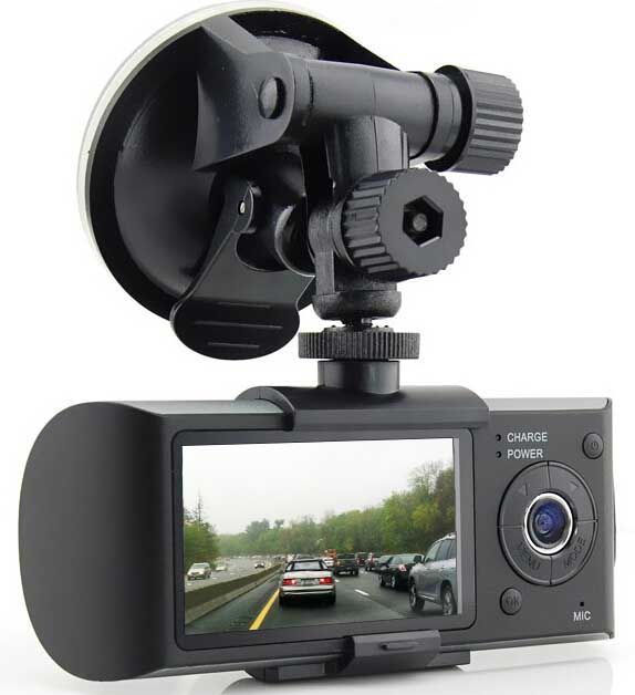 Dash cam mounted on a windshield, displaying traffic on a highway.