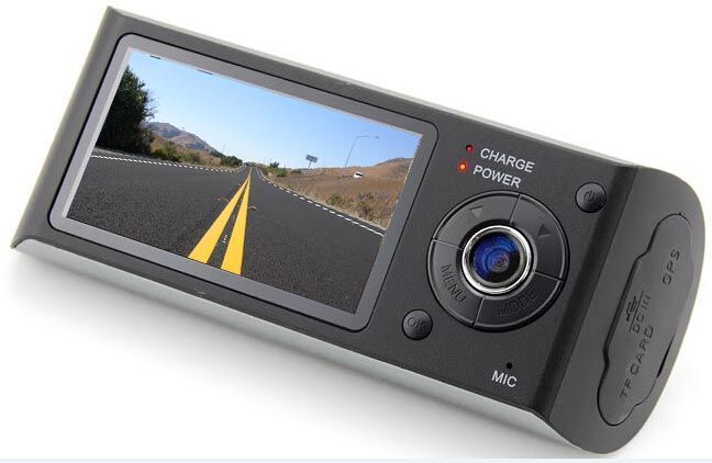 Dashcam with a road view on the screen, black casing, buttons, and SD card slot.