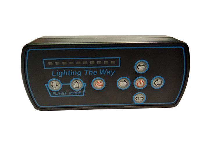 Black control panel with buttons and LED lights; text 