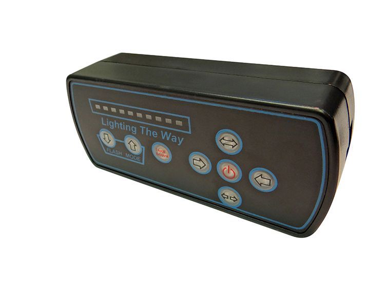 Black control panel with buttons and LED lights, labeled 