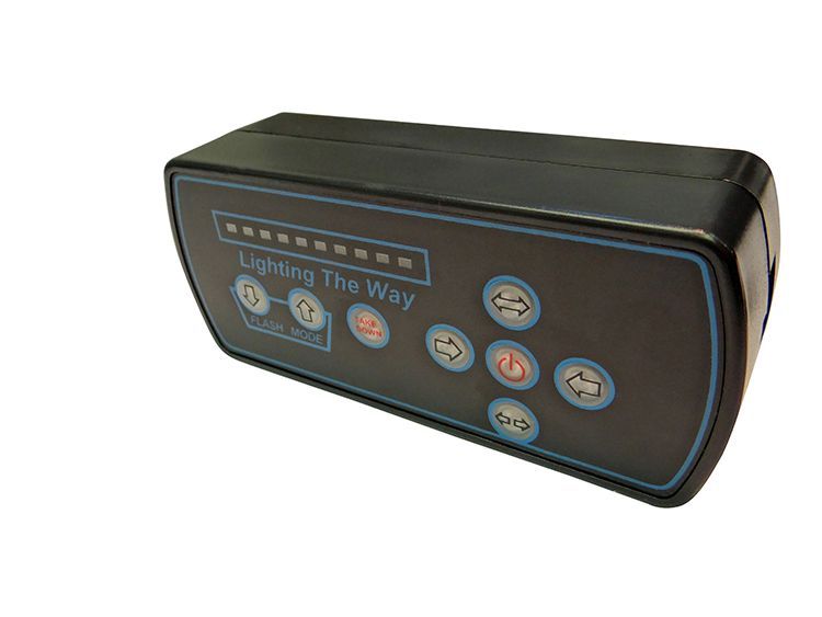 Black control panel with buttons, a display and the words 