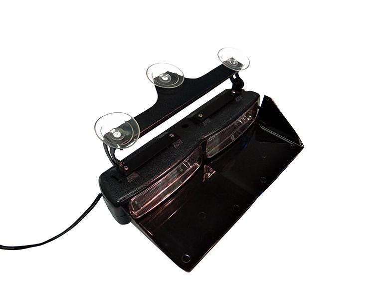 Black visor emergency light with suction cups and power cord.