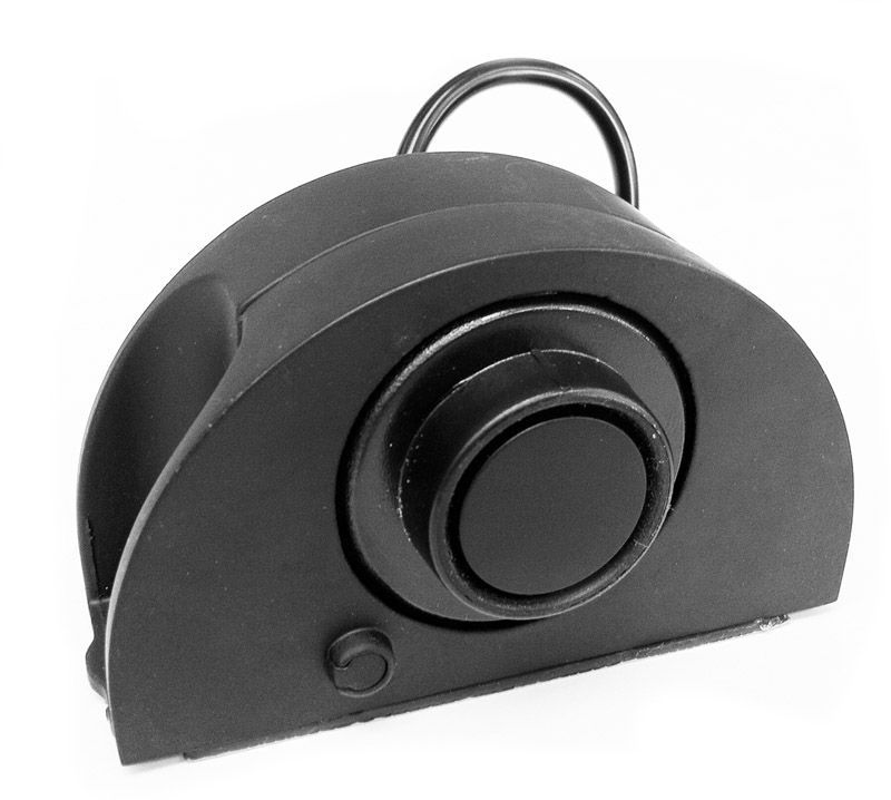Black foot pedal with a large circular button, and a small button below it.