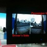 A screen shows a view from the passenger side and driver's side of a vehicle.